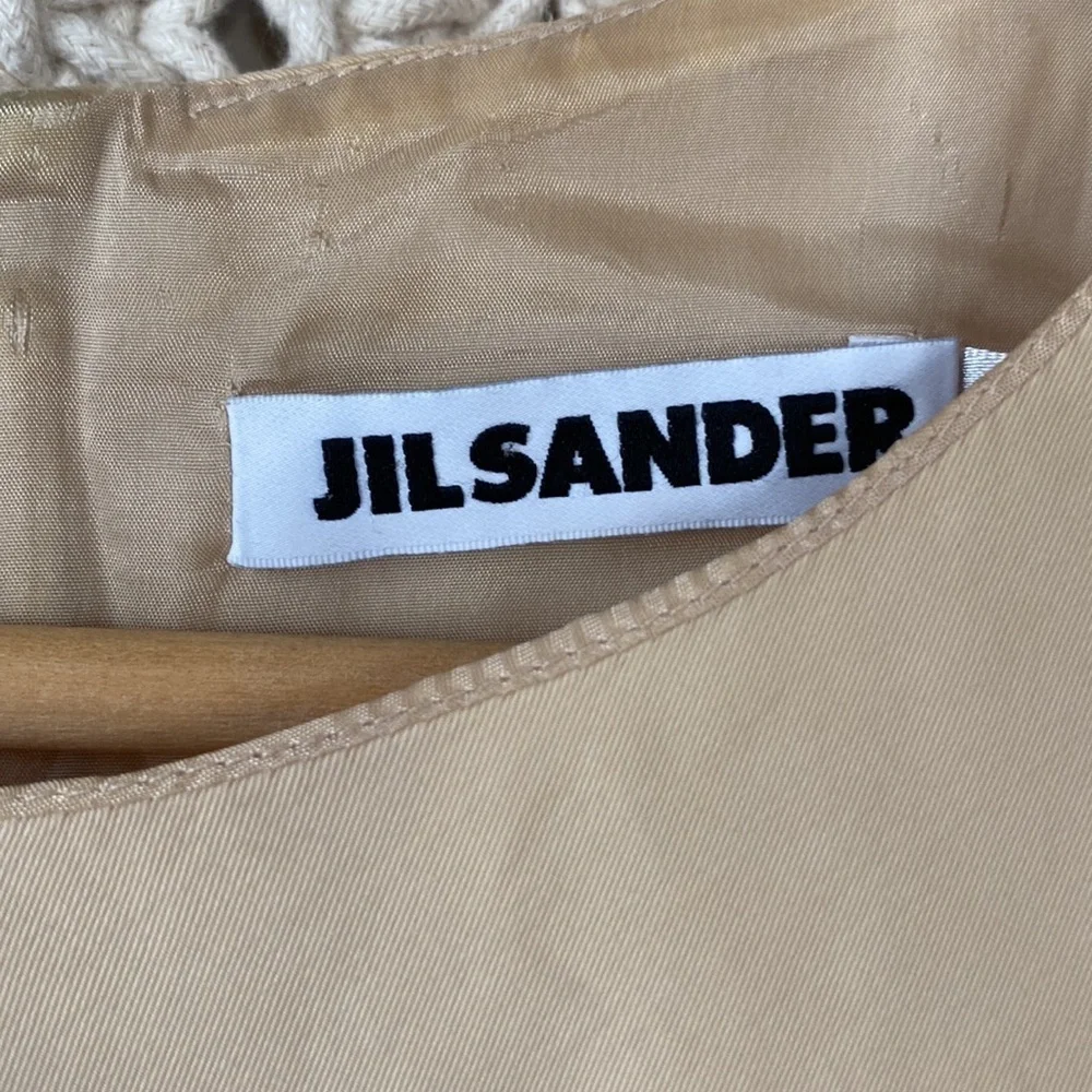 Jil Sander Designer midi dress in a eggshell cream color, fitted cockta…